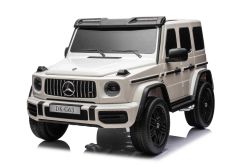 Auto elettrica per bambini Mercedes-Benz G63 AMG 4x4² due posti 12V, bianca, lettore MP3 con ingresso USB/AUX, trazione 4x4, batteria 12V14Ah, ruote EVA con sospensione, sedili in similpelle, telecomando, licenza